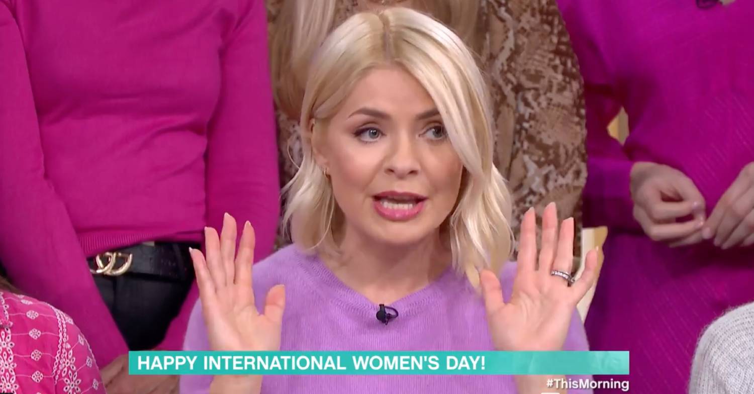 Holly Willoughby raises her hands during International Women's Day address