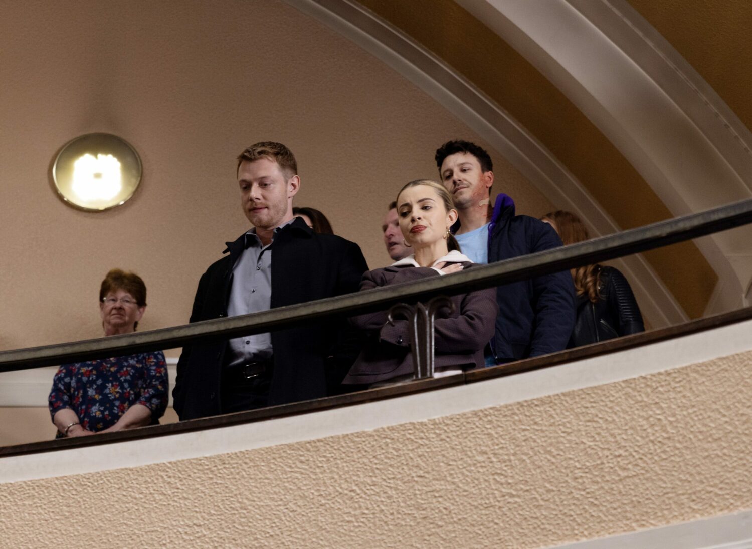 Daniel, Daisy and Ryan in Coronation Street watch from the gallery in court