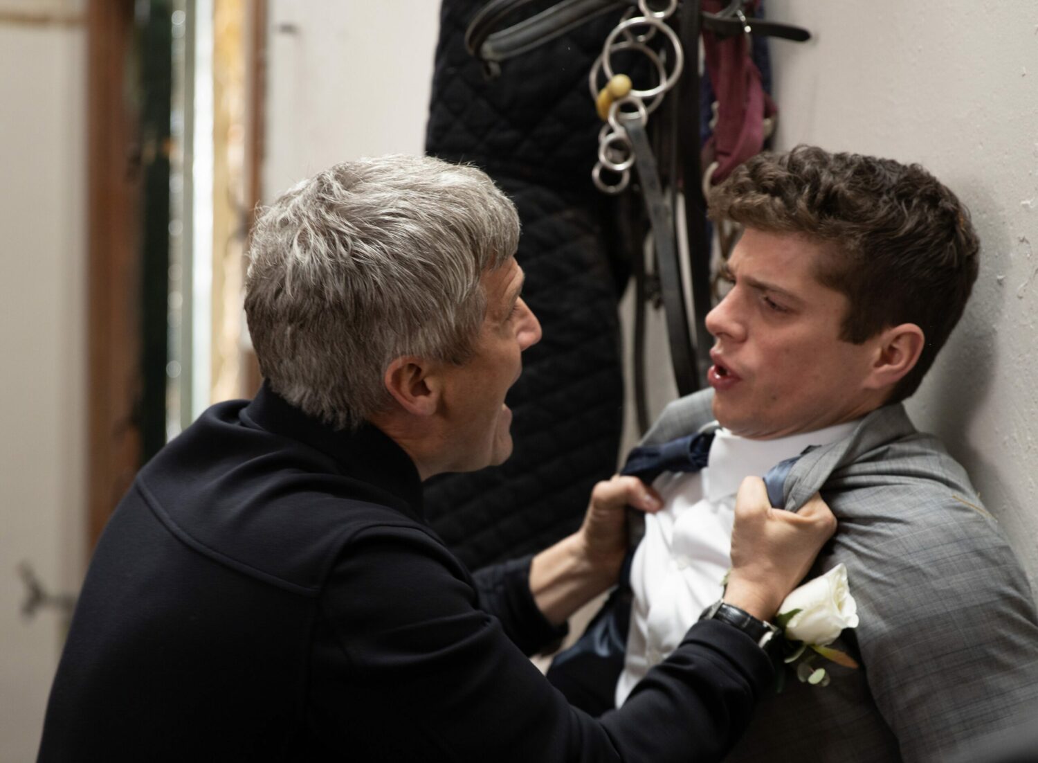 Caleb Miligan grabs son Nicky by the jacket and rages at him