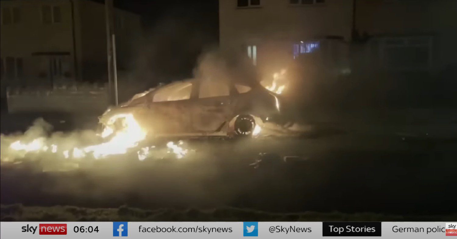 Car on fire in Cardiff riots 