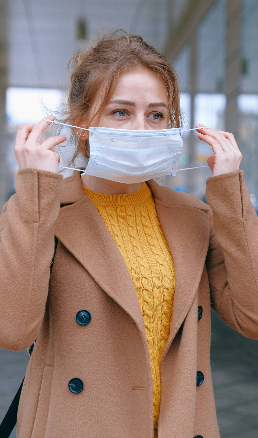 Woman puts on a mask