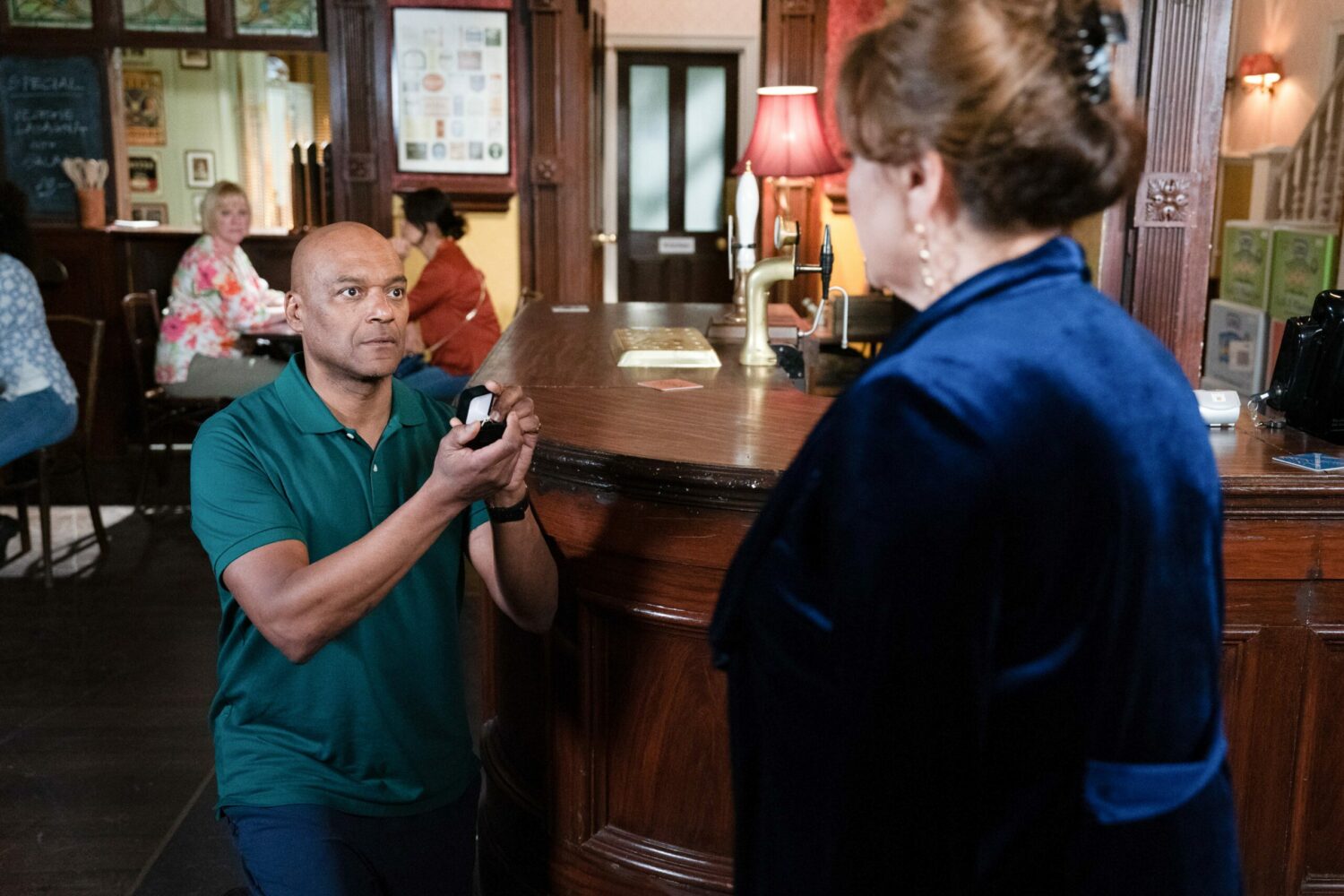 George gets down on one knee and proposes to Elaine in EastEnders