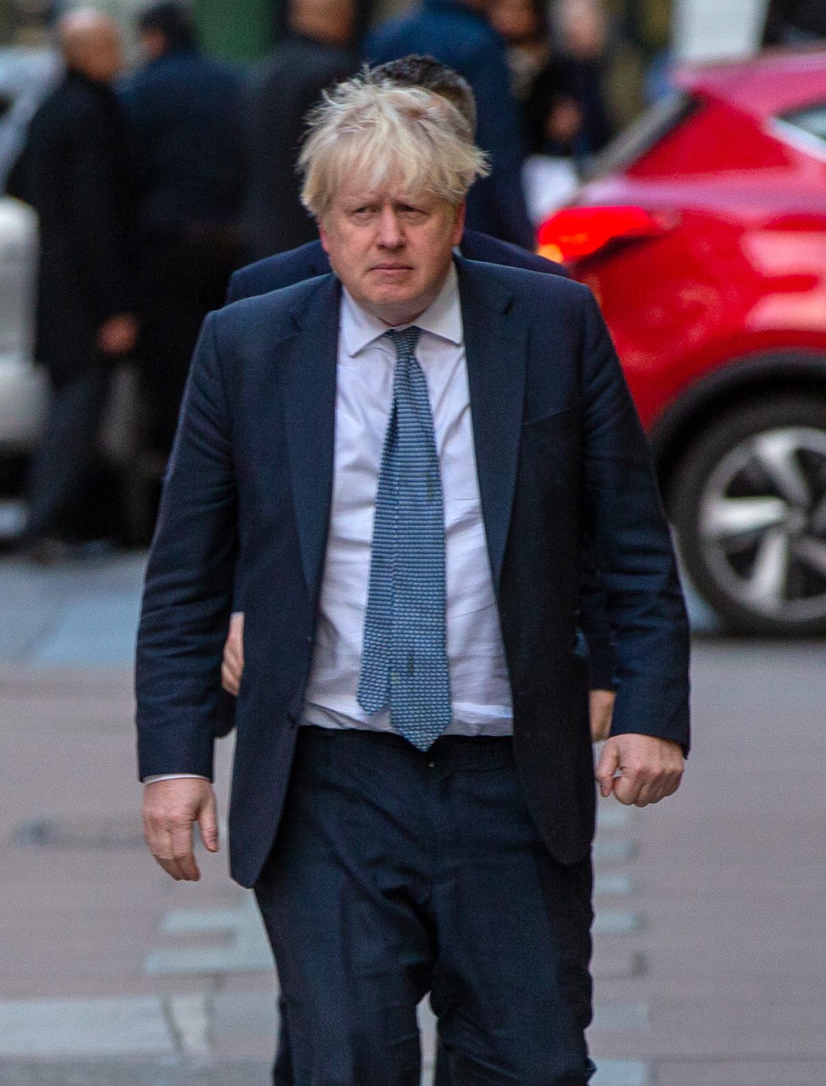 Boris Johnson frowns outside