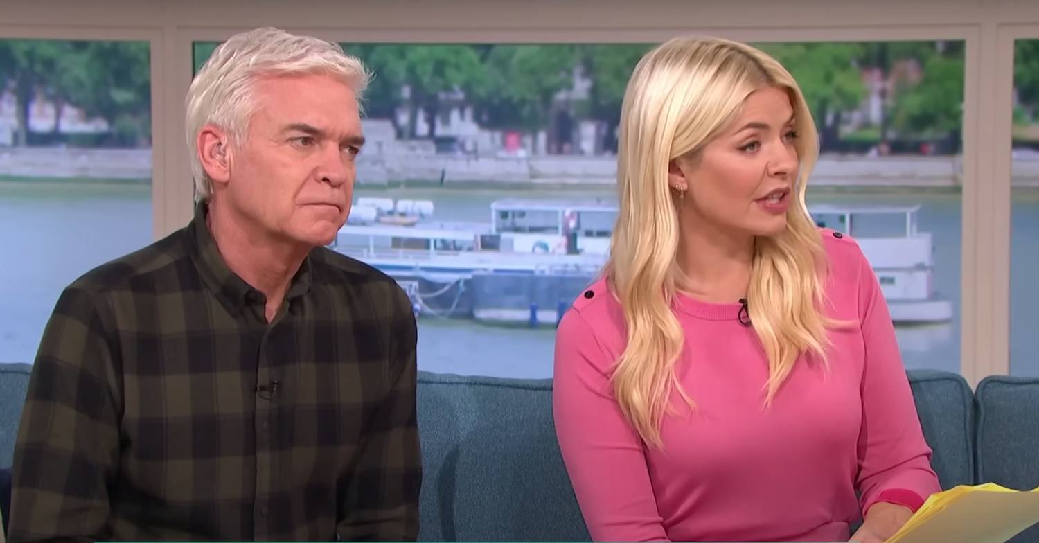 Phillip Schofield listens as Holly Willoughby asks a question