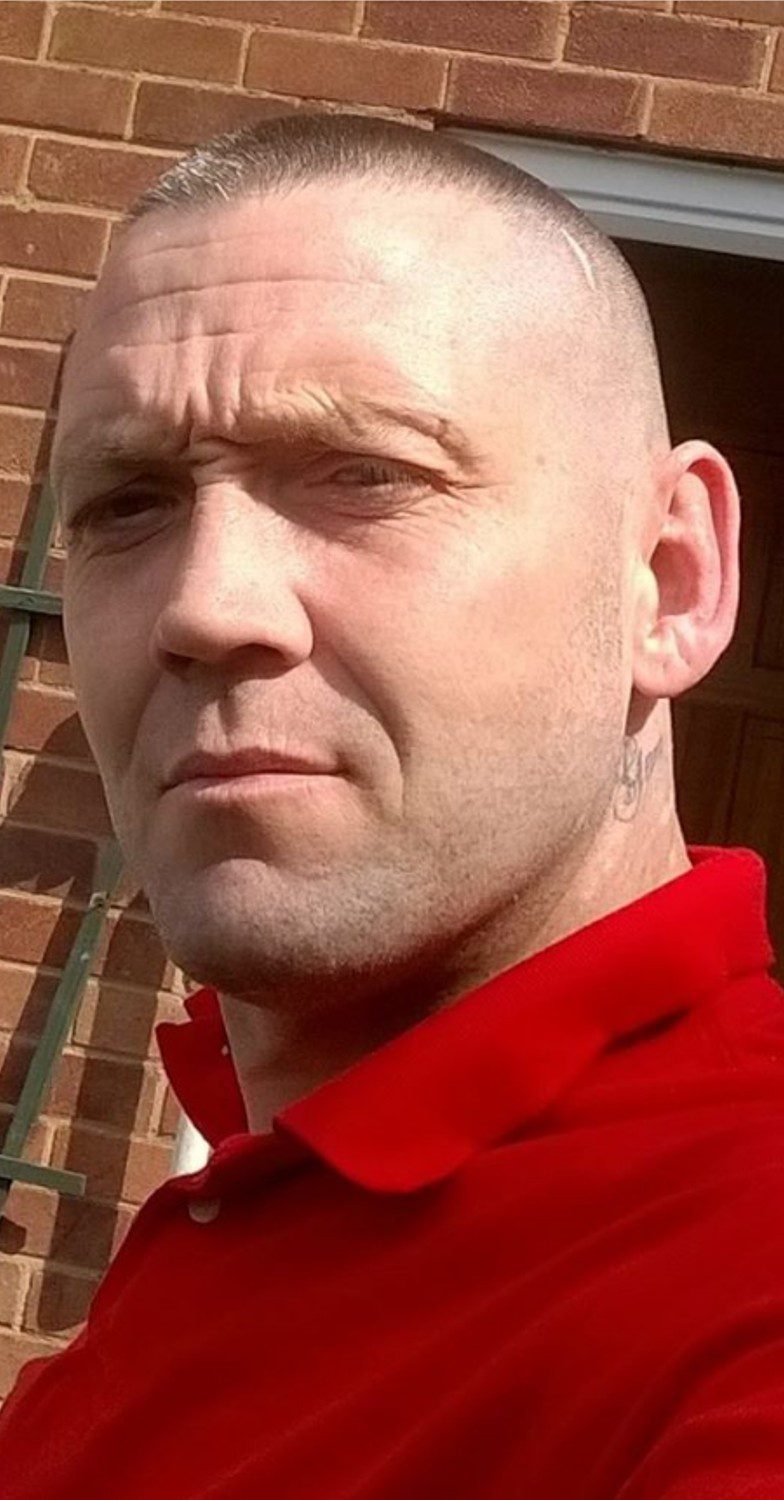 Karl Warburton in a red top