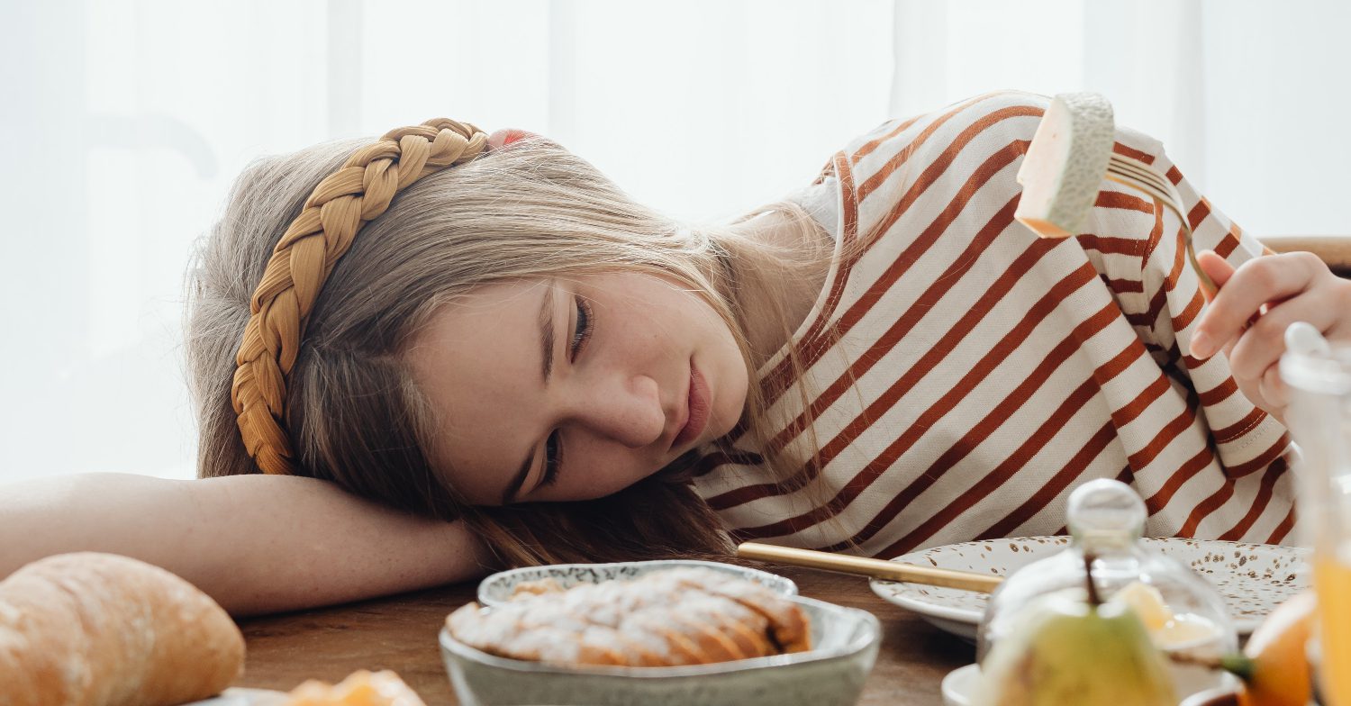 A girl frowns at food