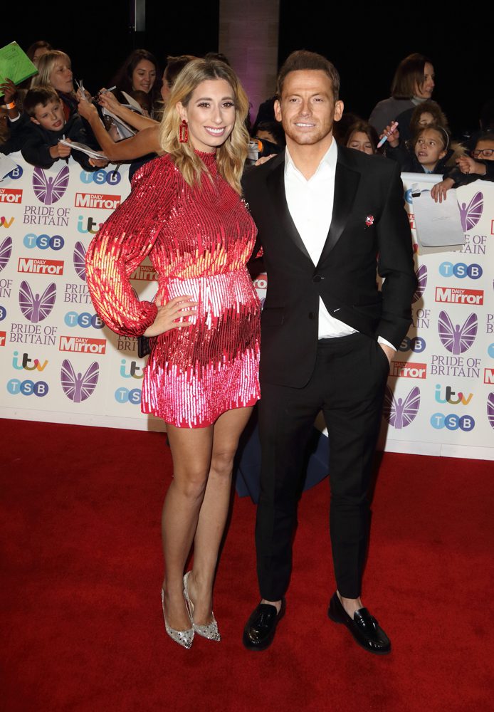Joe Swash and Stacy Solomon on the red carpet smiling