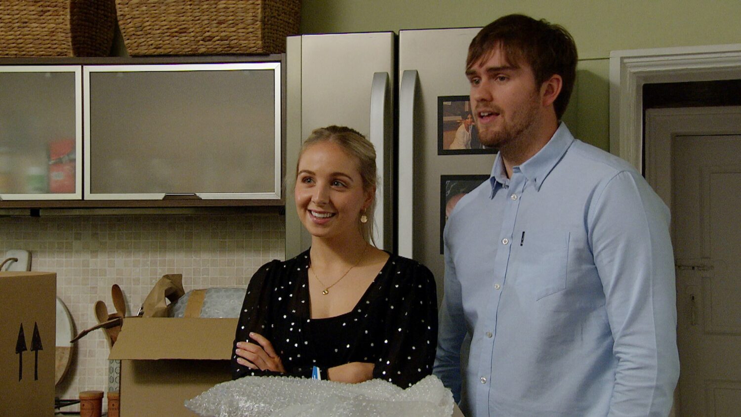 Belle and Tom smiling on Emmerdale