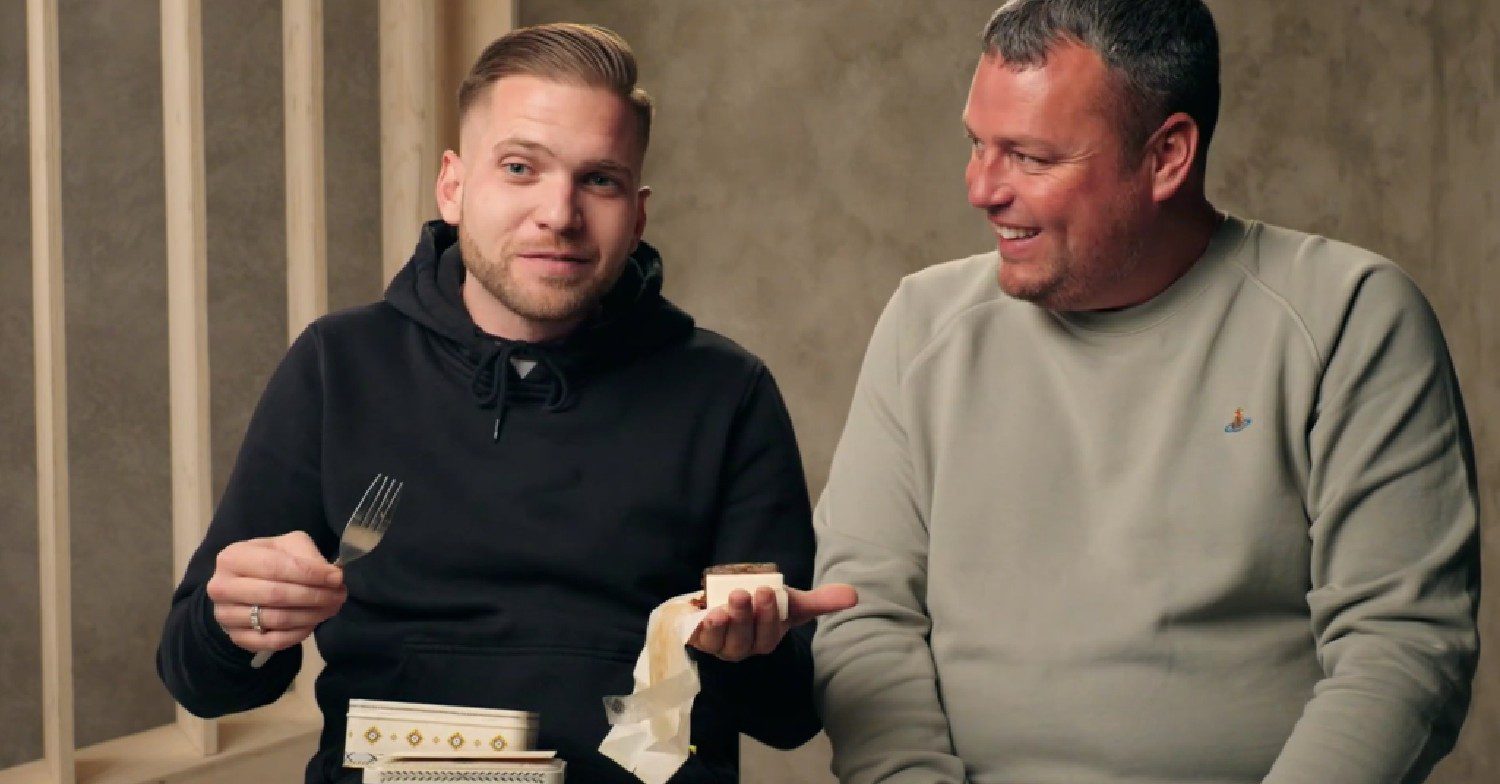 Person holding Kate Middleton and Prince William's wedding cake