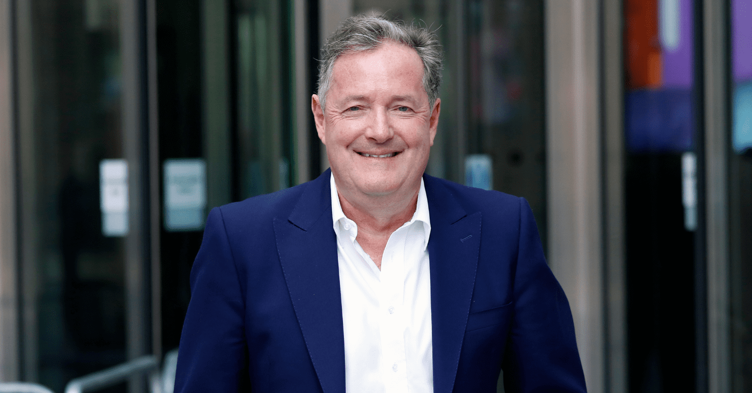 Piers Morgan wears a suit and poses for pics