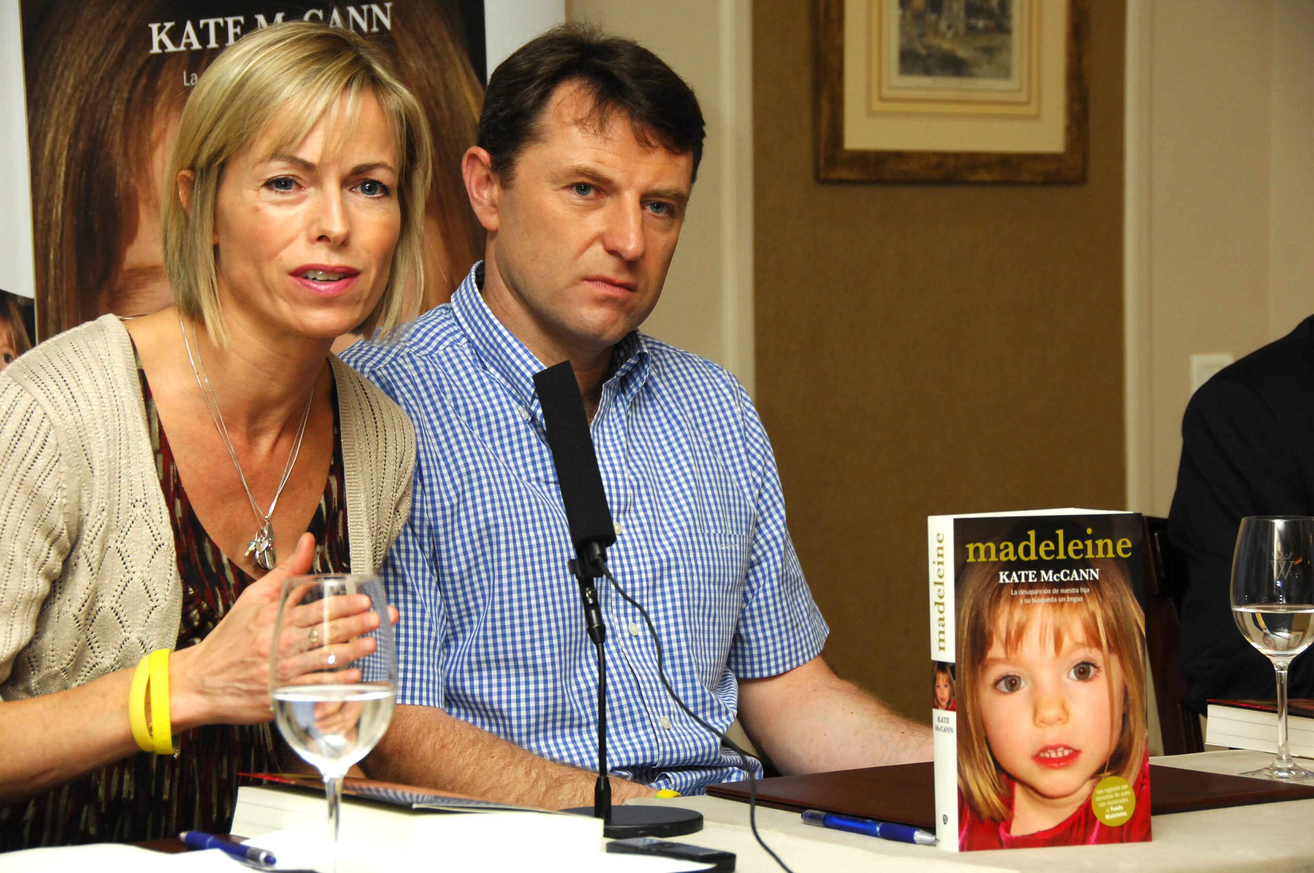 Kate and Gerry McCann holding a copy of their Madeleine book