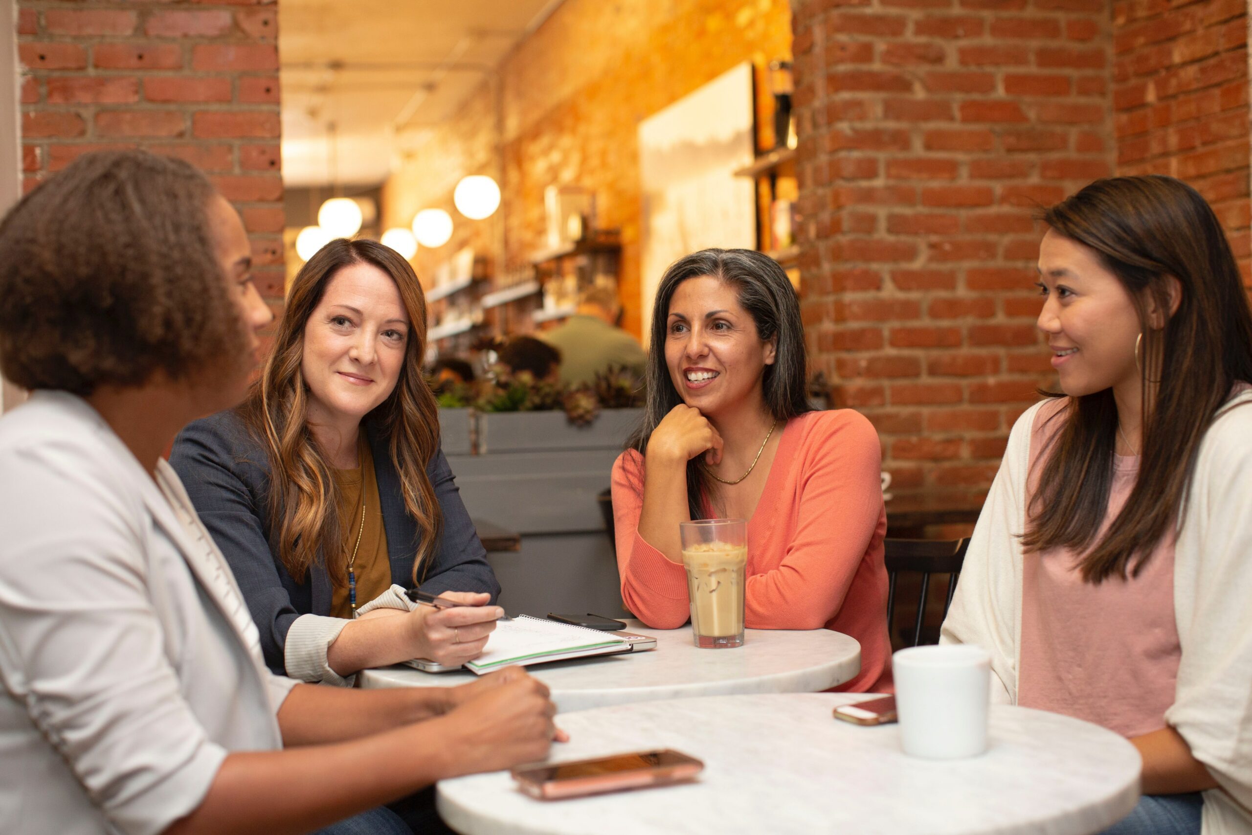 Colleagues sit around a table