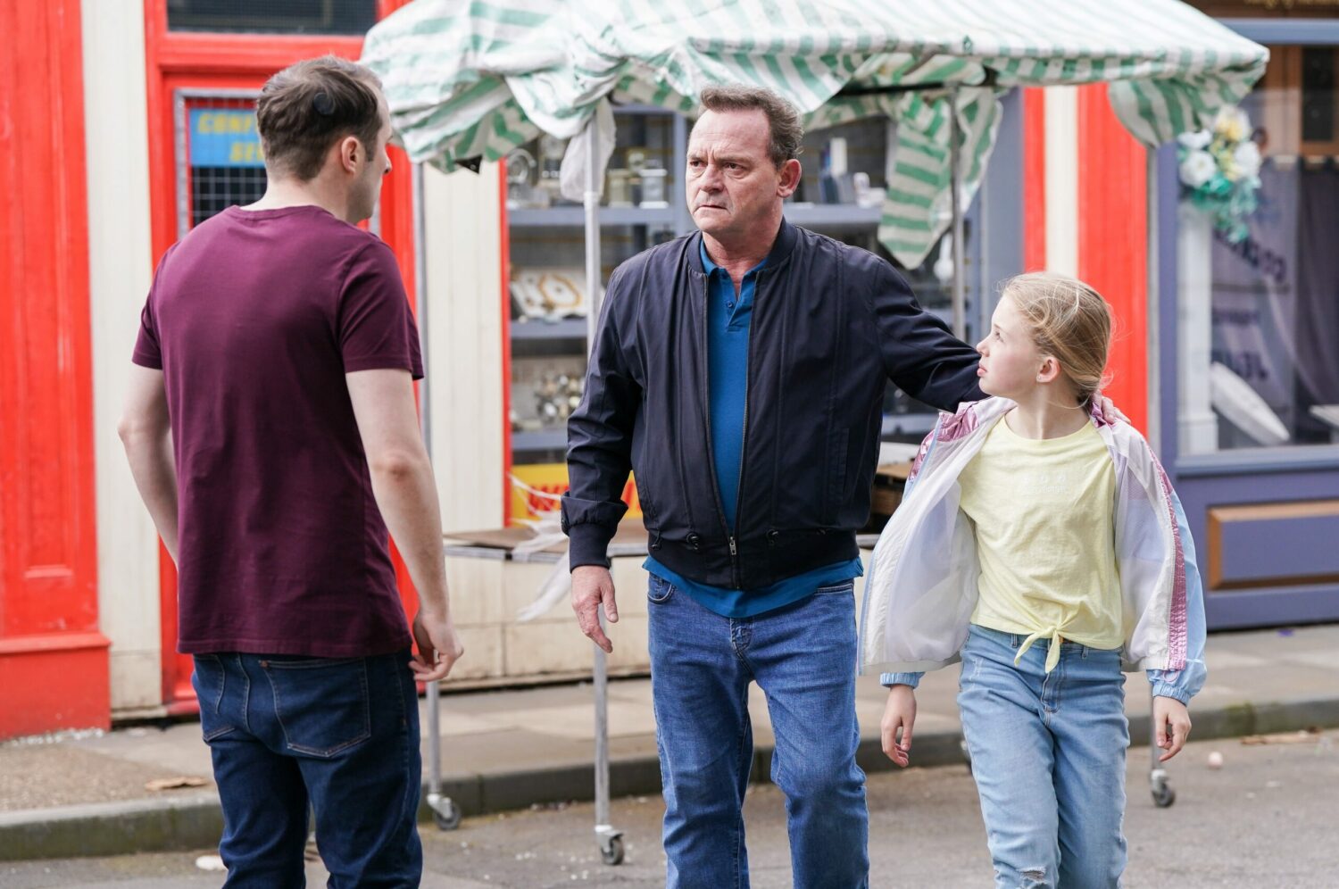 Billy looks angry as he talks to Ben, standing with Lexi on EastEnders