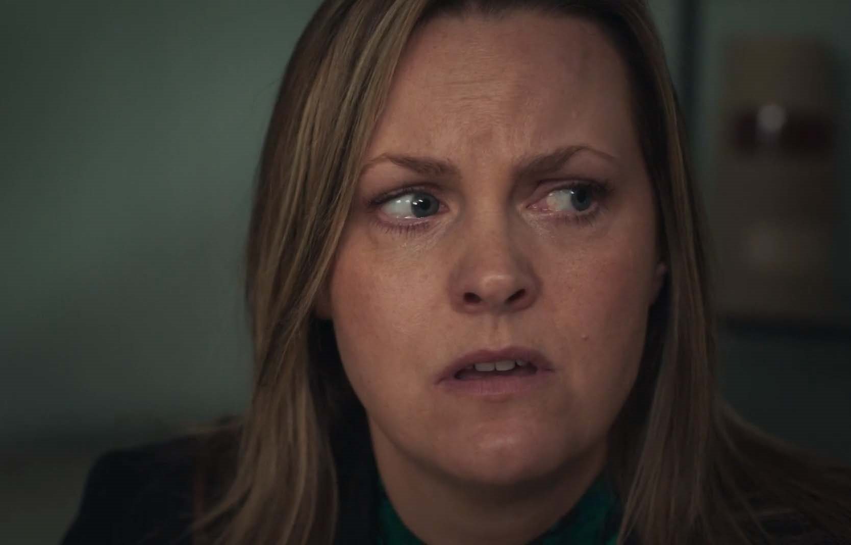 Laura looks around her in For Her Sins