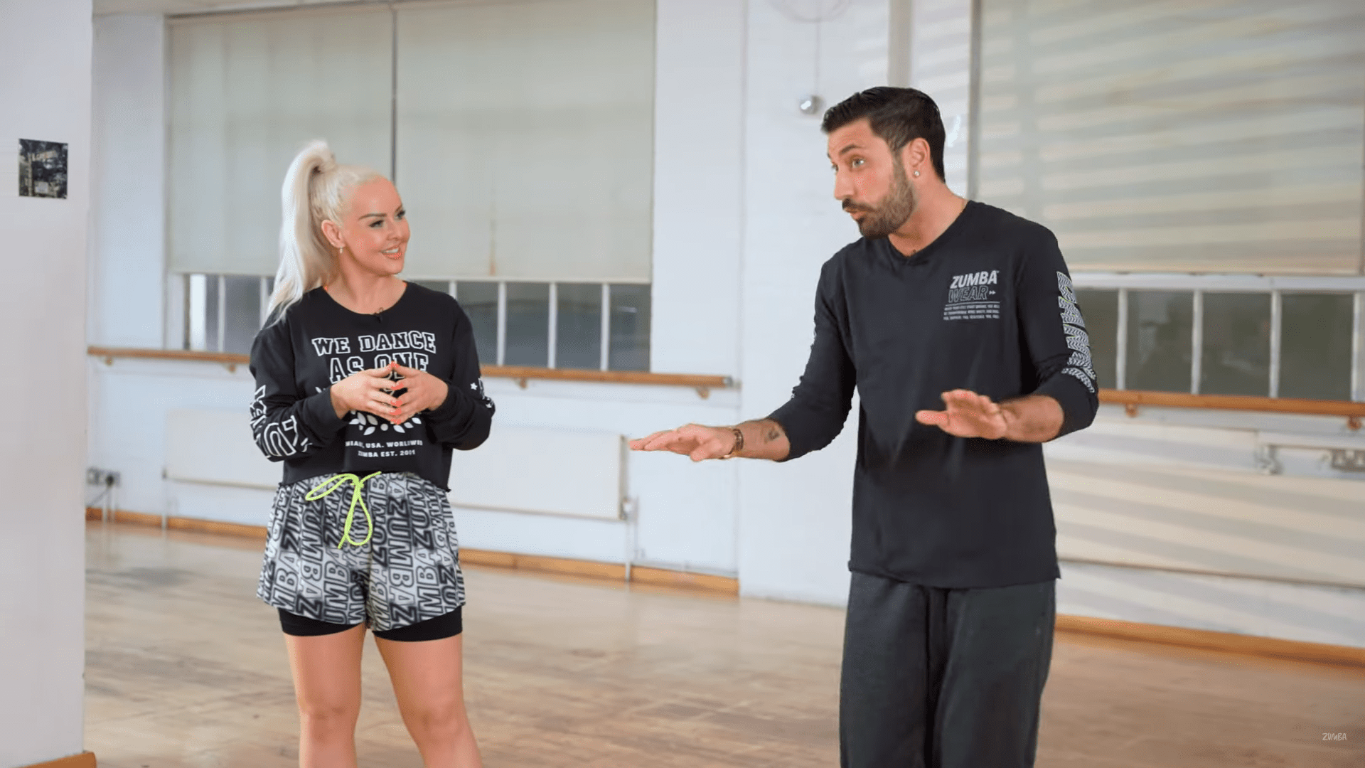 Giovanni speaks with Zumba instructor