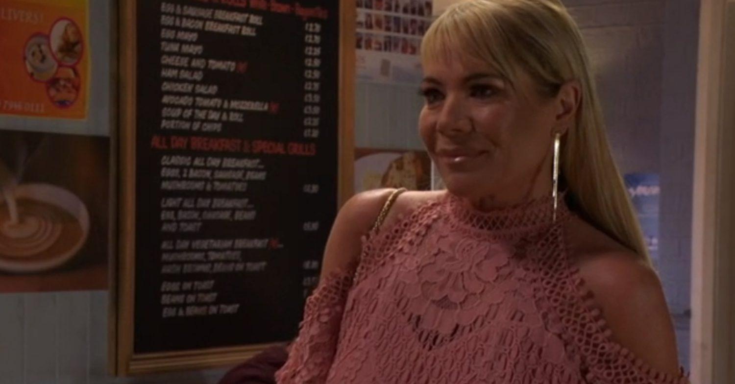 EastEnders' Sharon is smiling, wearing a pink dress