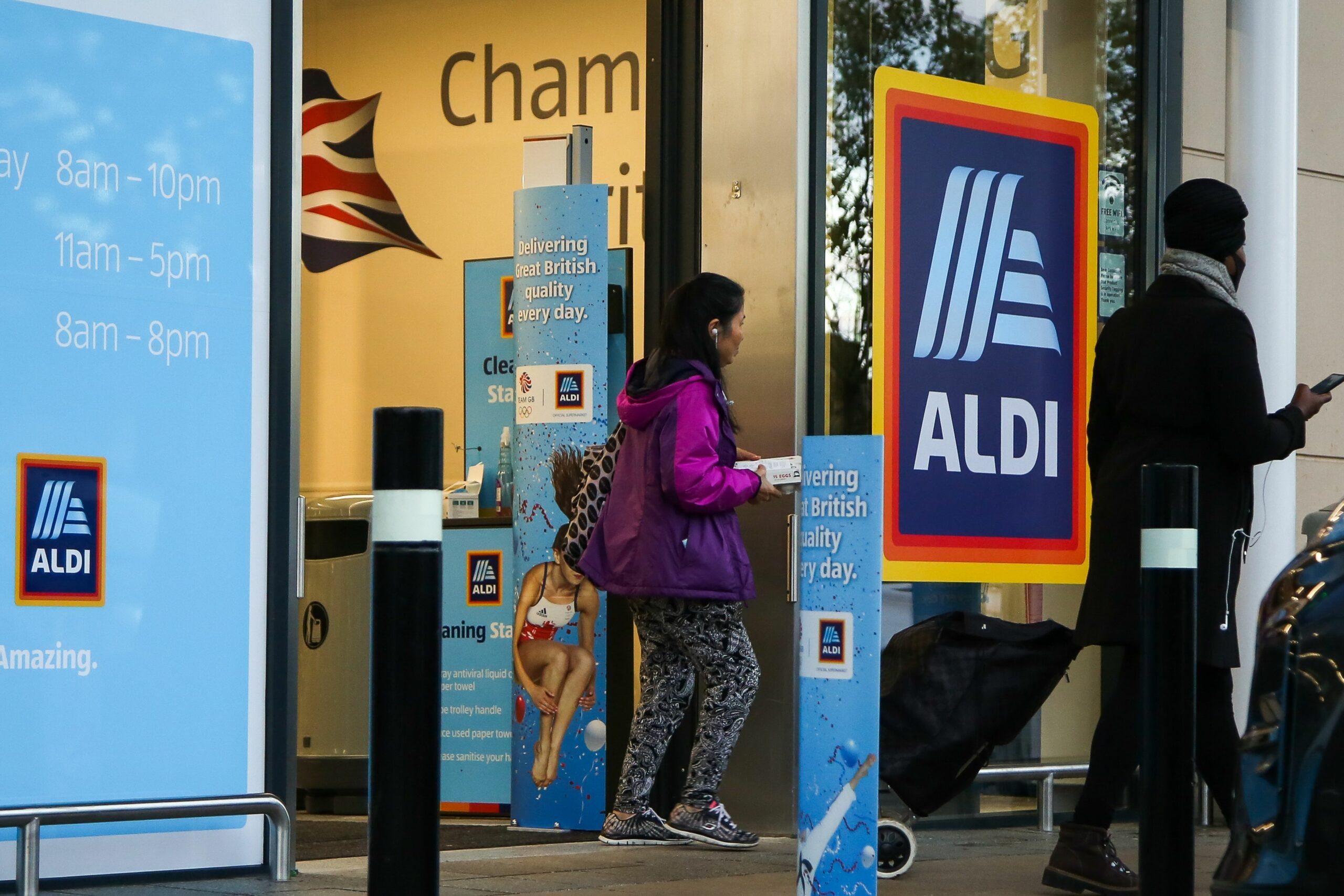 Shoppers walking outside Aldi