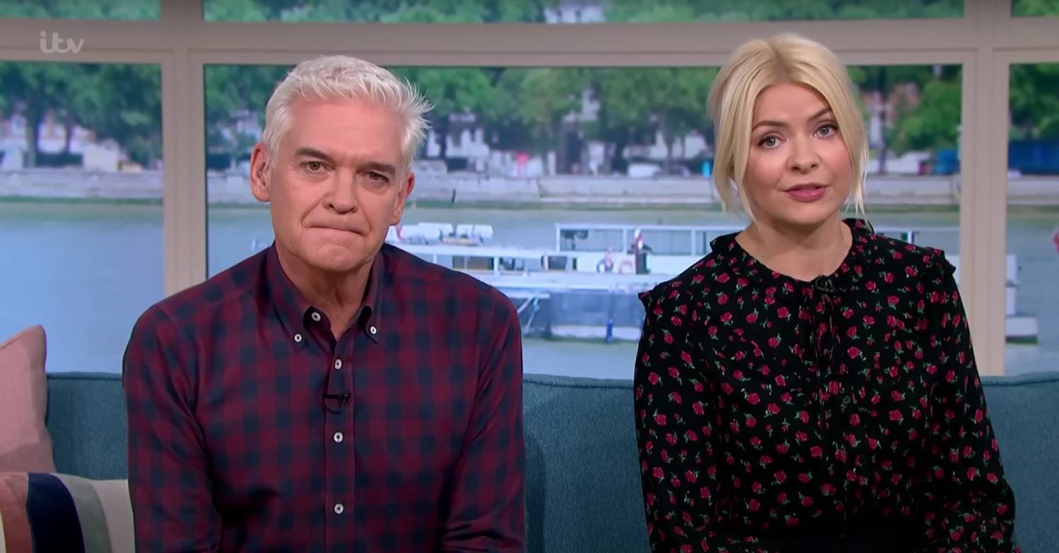 Phillip Schofield grimaces next to Holly Willoughby on This Morning