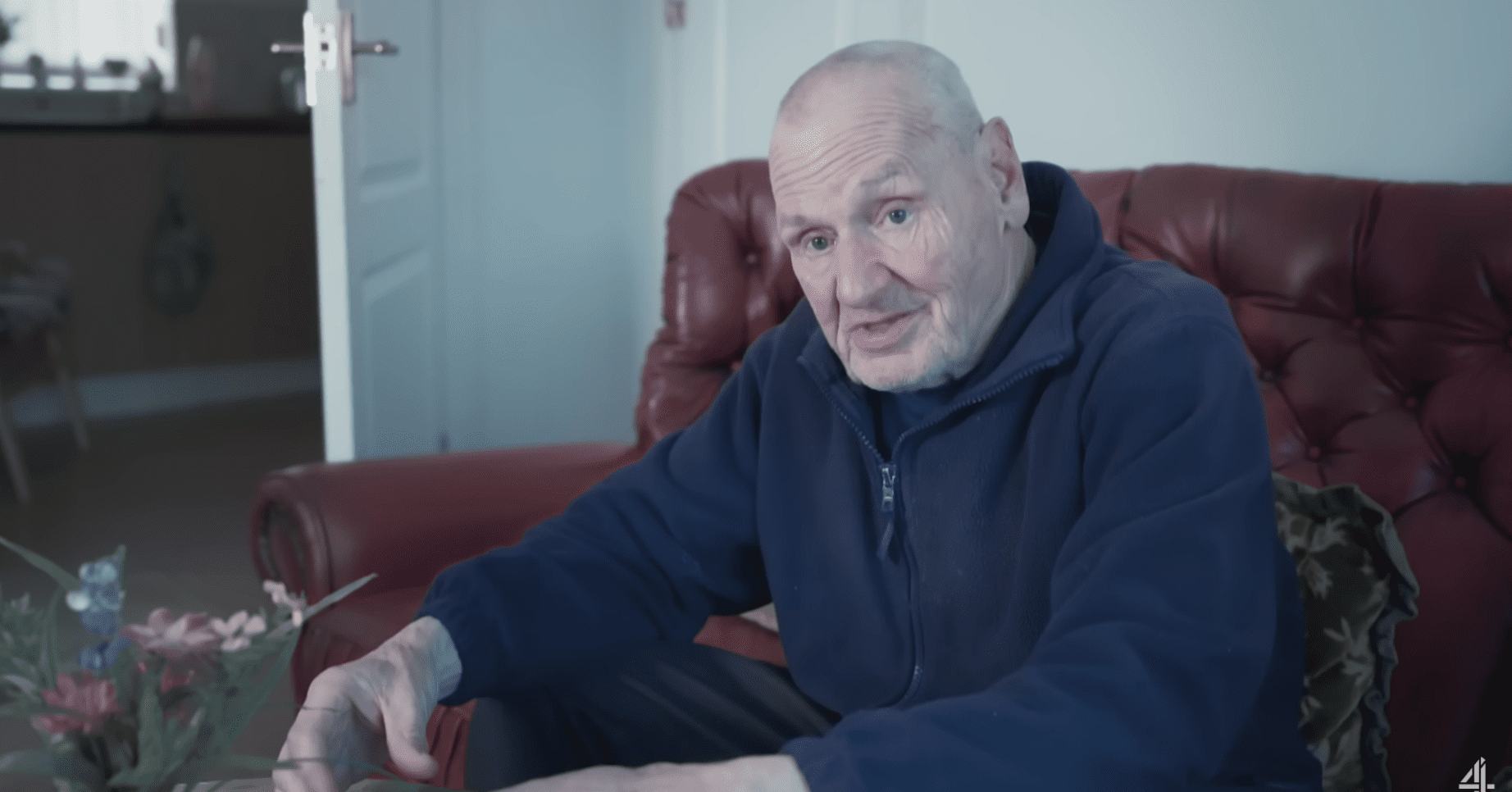 John Foster on Britain's Forgotten Pensioners sits on his sofa
