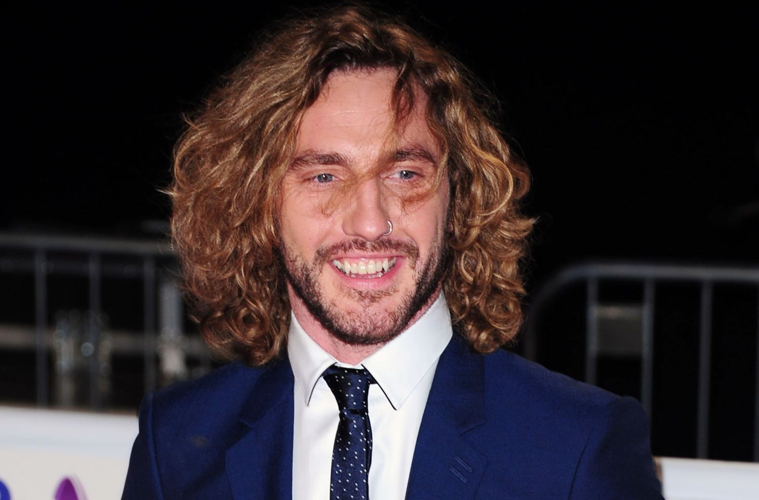 Seann Walsh smiles on the red carpet