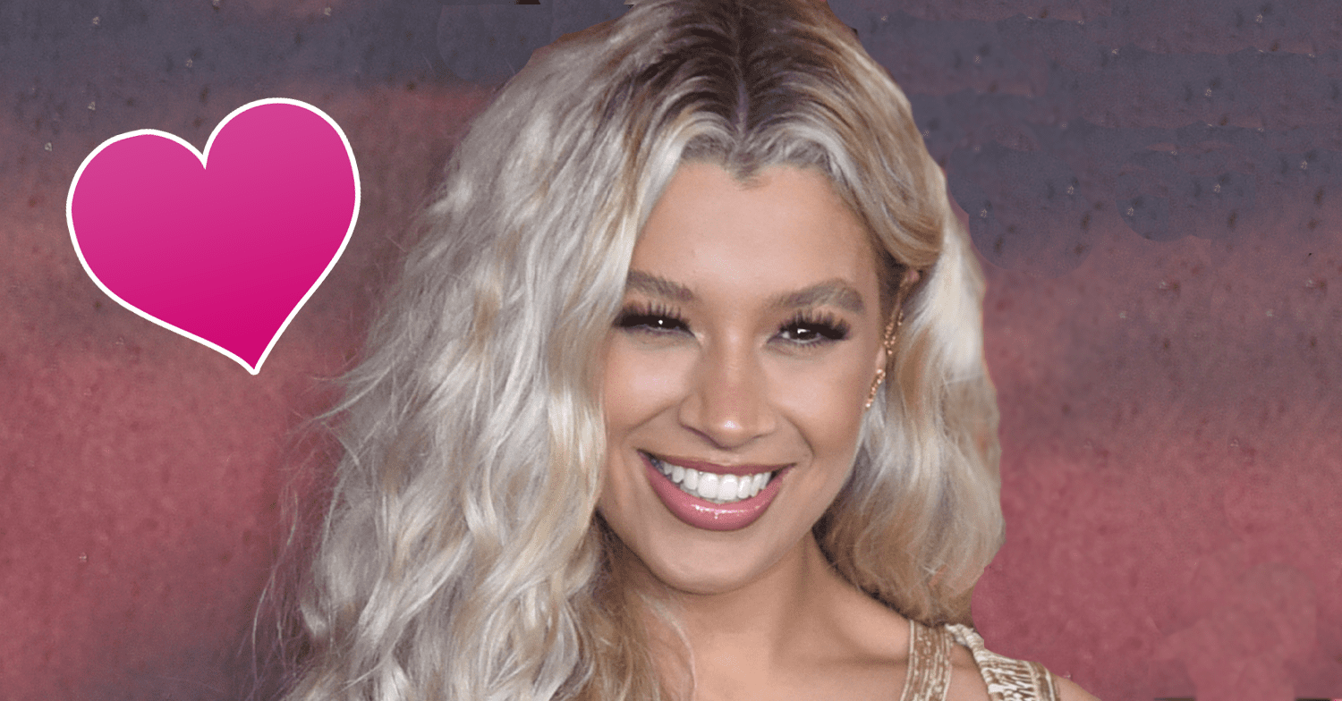 Molly Rainford with a pink love heart