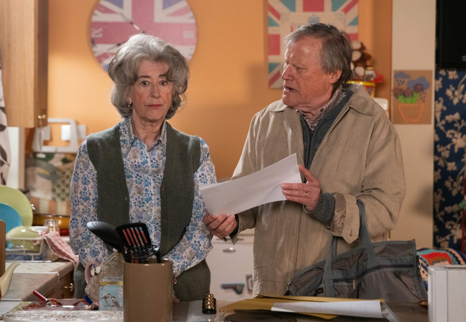Evelyn looks forlorn with Roy's proposed schedule in Coronation Street