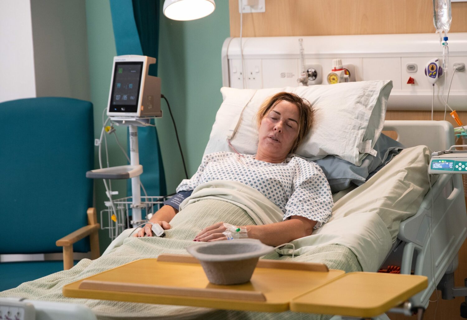 Cassie lying unconscious in hospital bed on Corrie