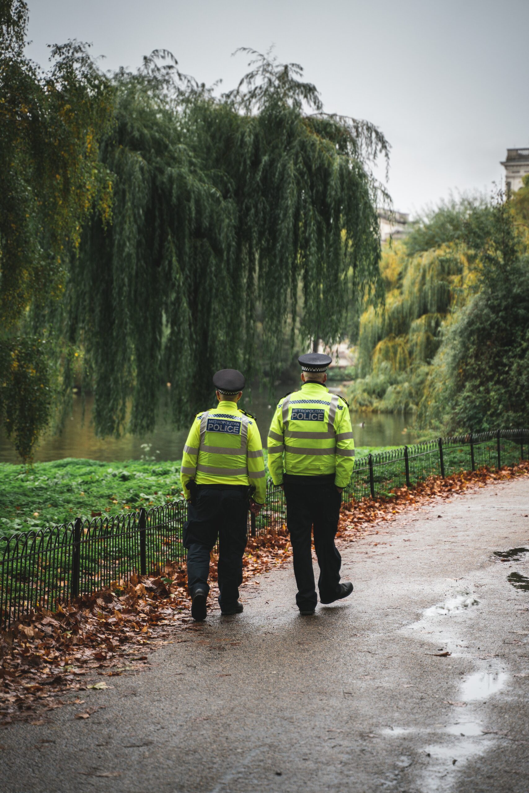 Two police officers walking in the park