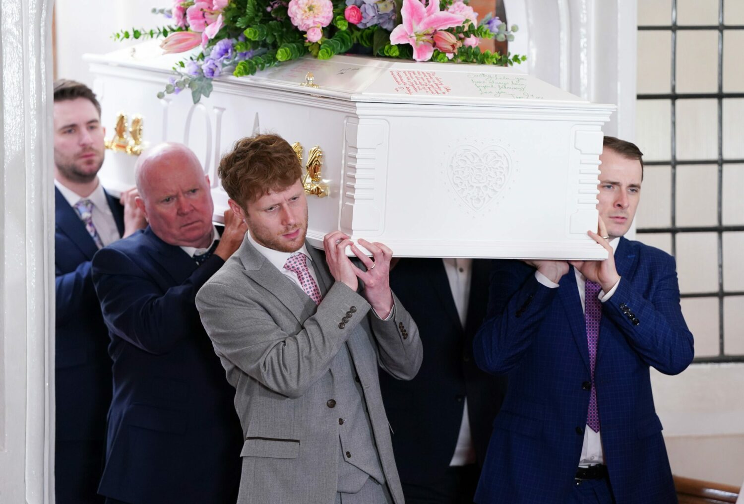 EastEnders' Jay, Phil, Callum and Ben are carrying Lola's white coffin