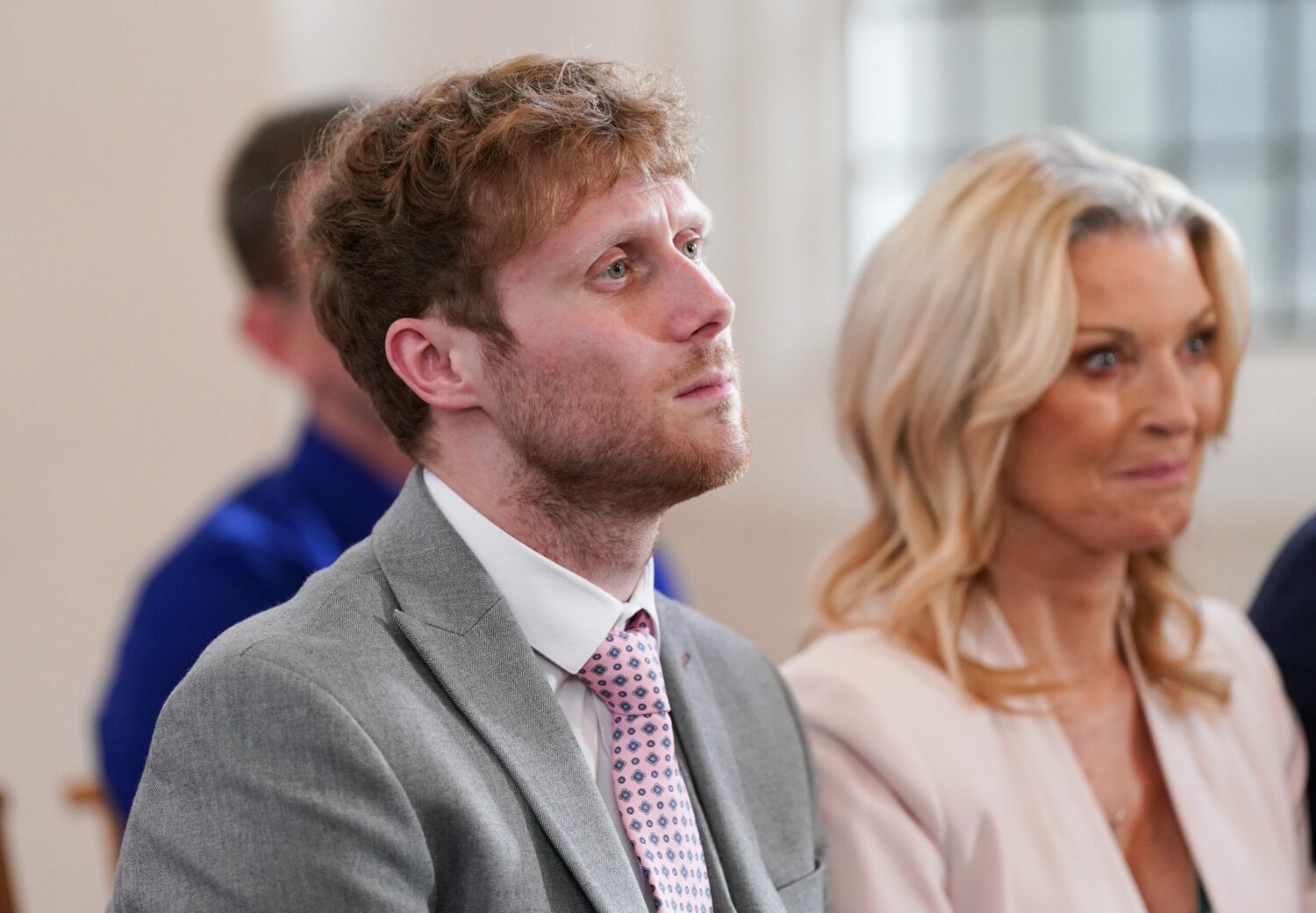 EastEnders' Jay has a beard and is sitting down at Lola's funeral next to Kathy