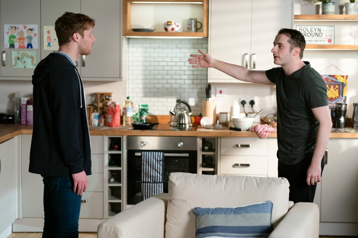 Jay and Ben in EastEnders argue and gesticulate