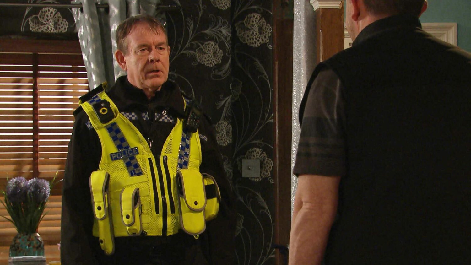 PC Swirling looks serious as he talks to Dan on Emmerdale