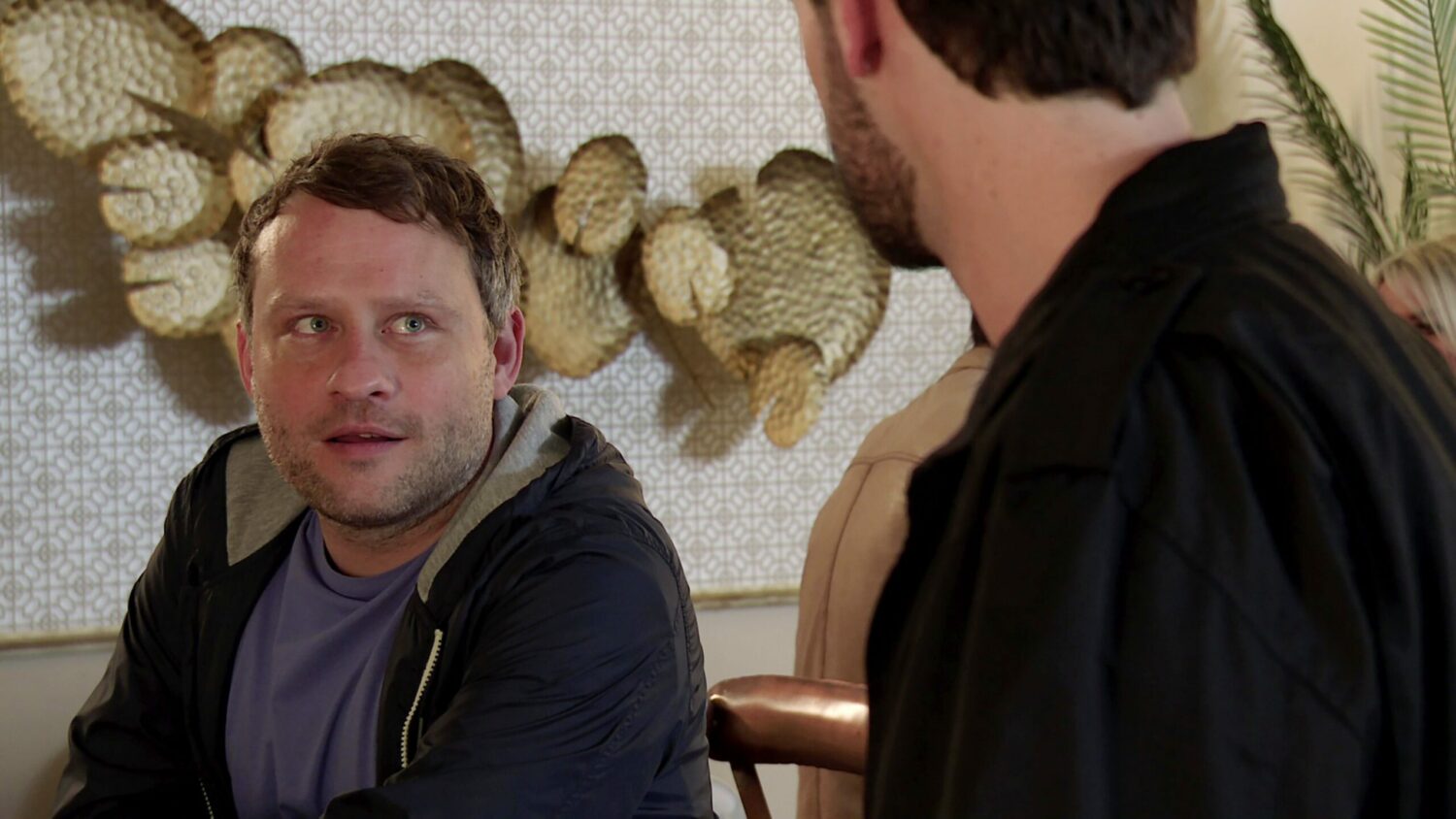 Paul smiling as he talks to Zac on Corrie
