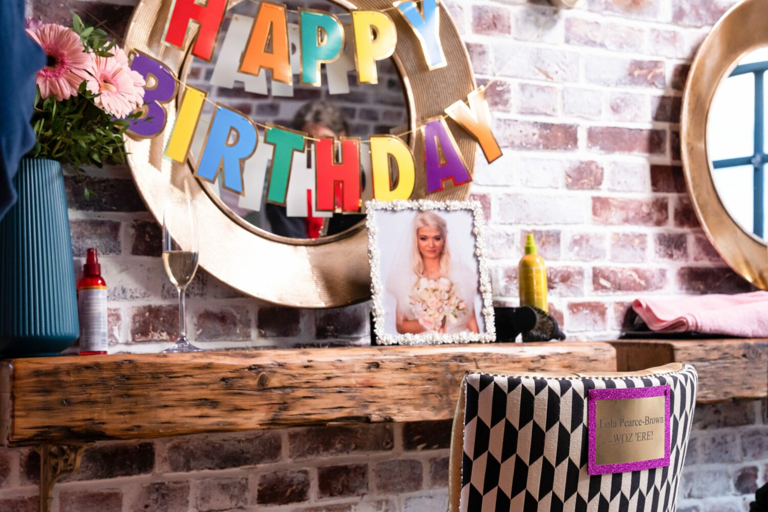 A picture of Lola next to birthday bunting on EastEnders