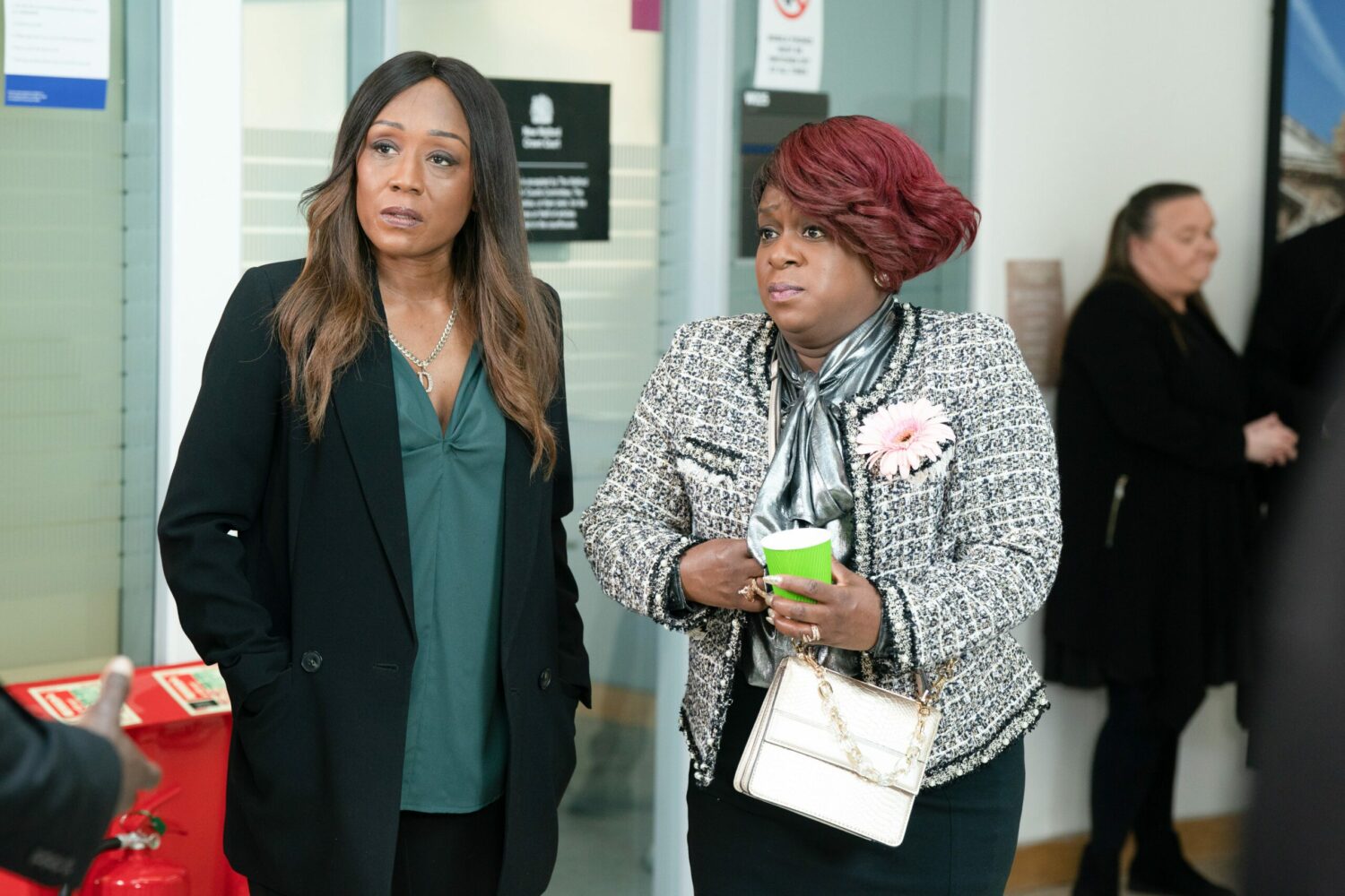 Kim and Denise look nervous in the courthouse on EastEnders