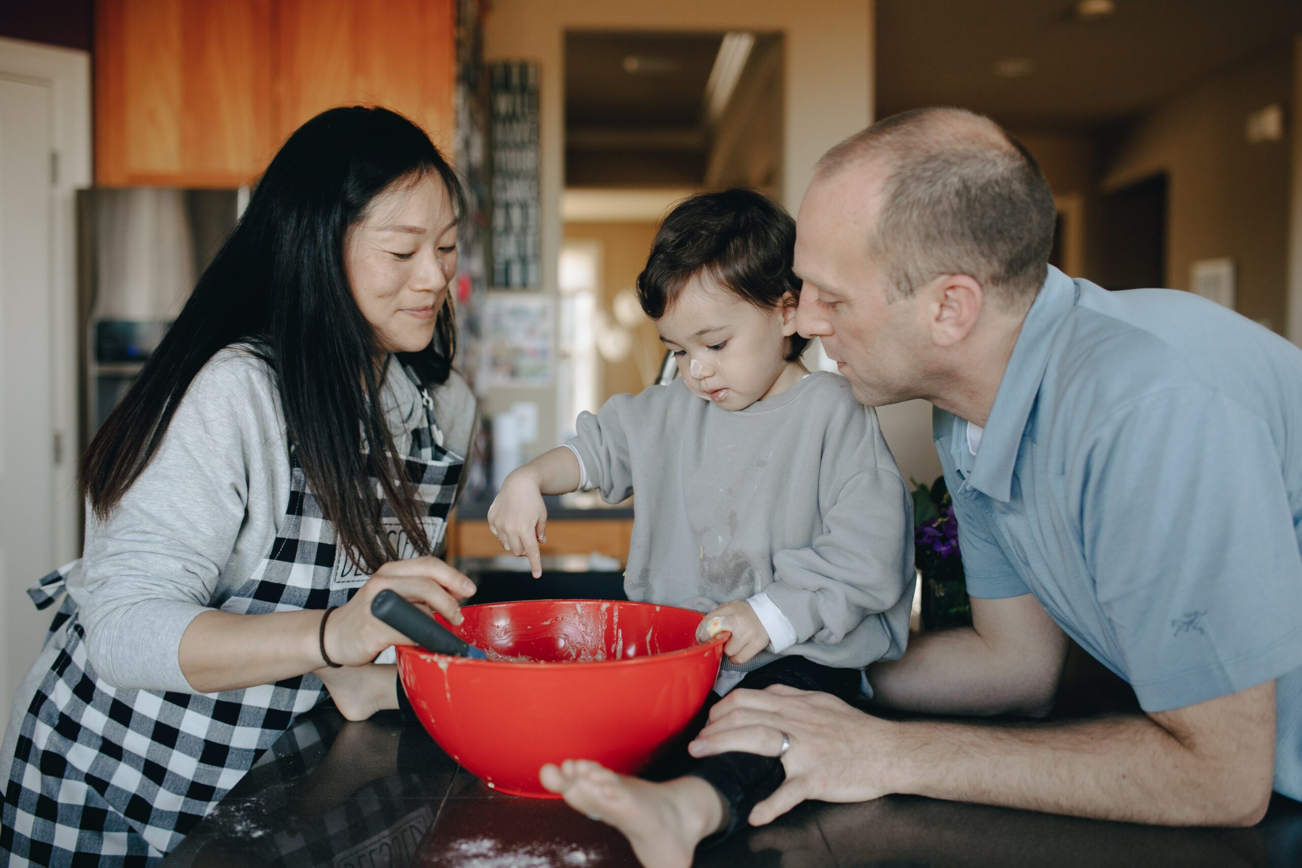 Parents and kid baking