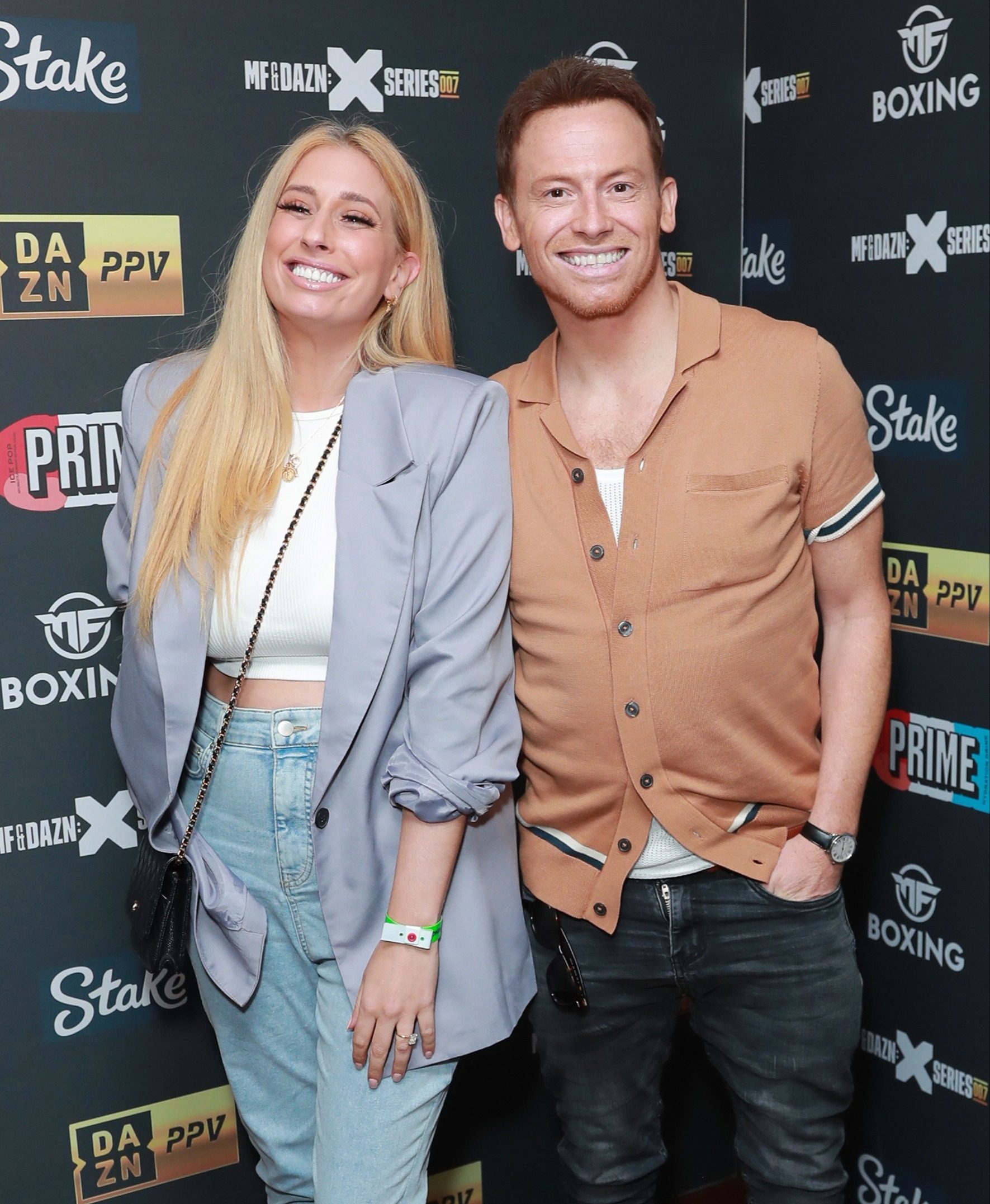 Stacey Solomon and Joe Swash smile at Boxing Event