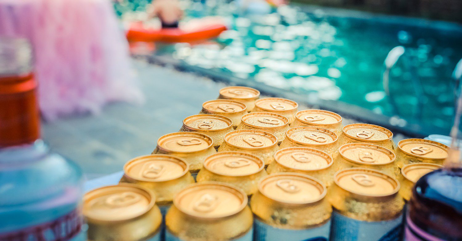 Beers next to a pool