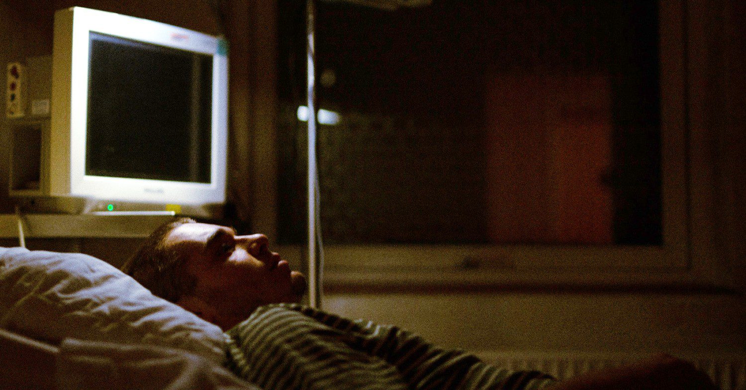 Person lying in hospital bed