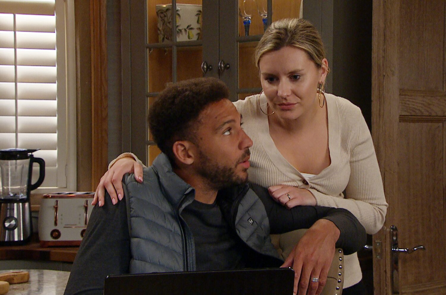 Billy and Dawn in Emmerdale look serious, but happy as they discuss the baby news