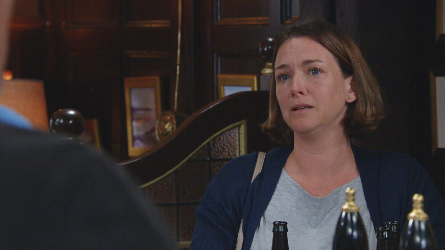 Emmerdale's Julie is teary-eyed in the pub