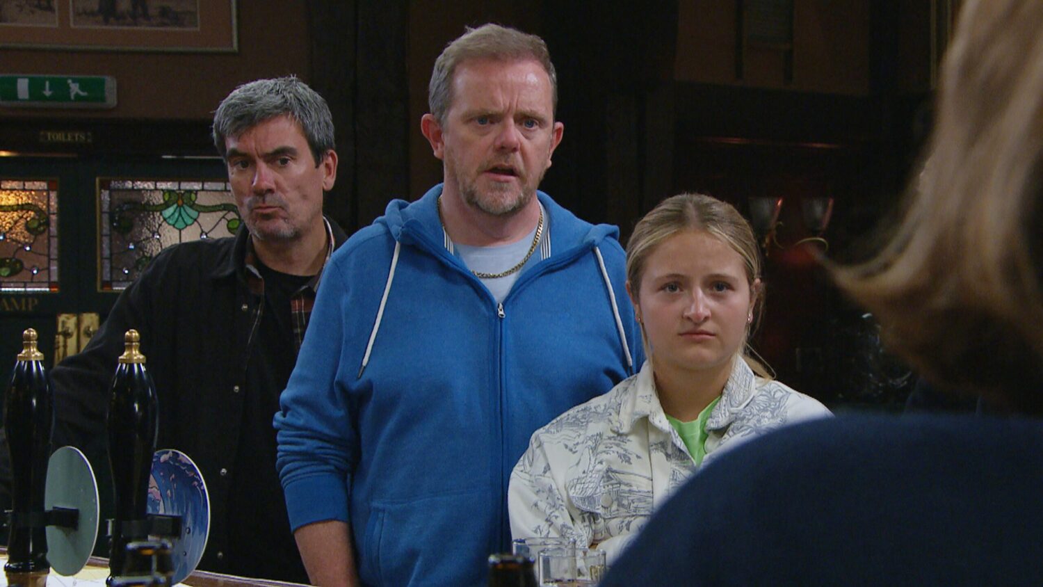 Cain Dingle, Dan and Amelia Spencer all look concerned in the Woolpack