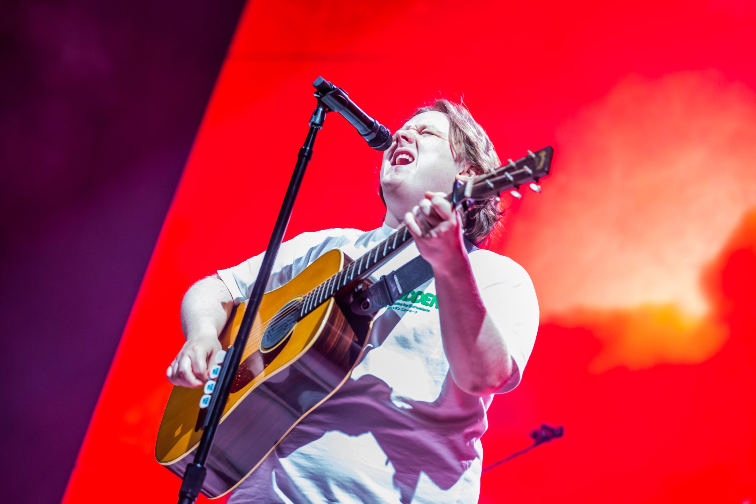 Lewis Capaldi singing and playing guitar