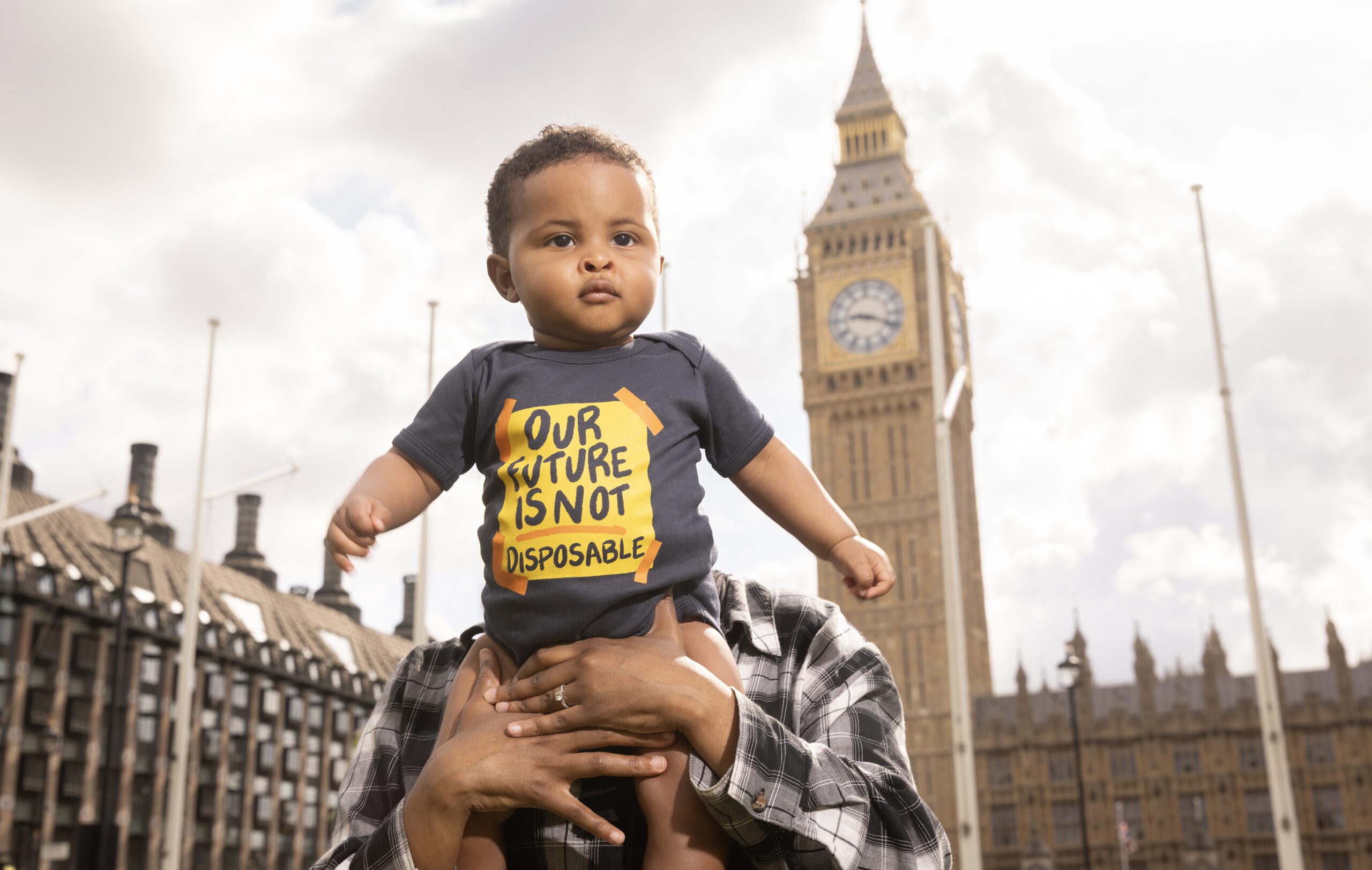 Baby held up at Parliament Square