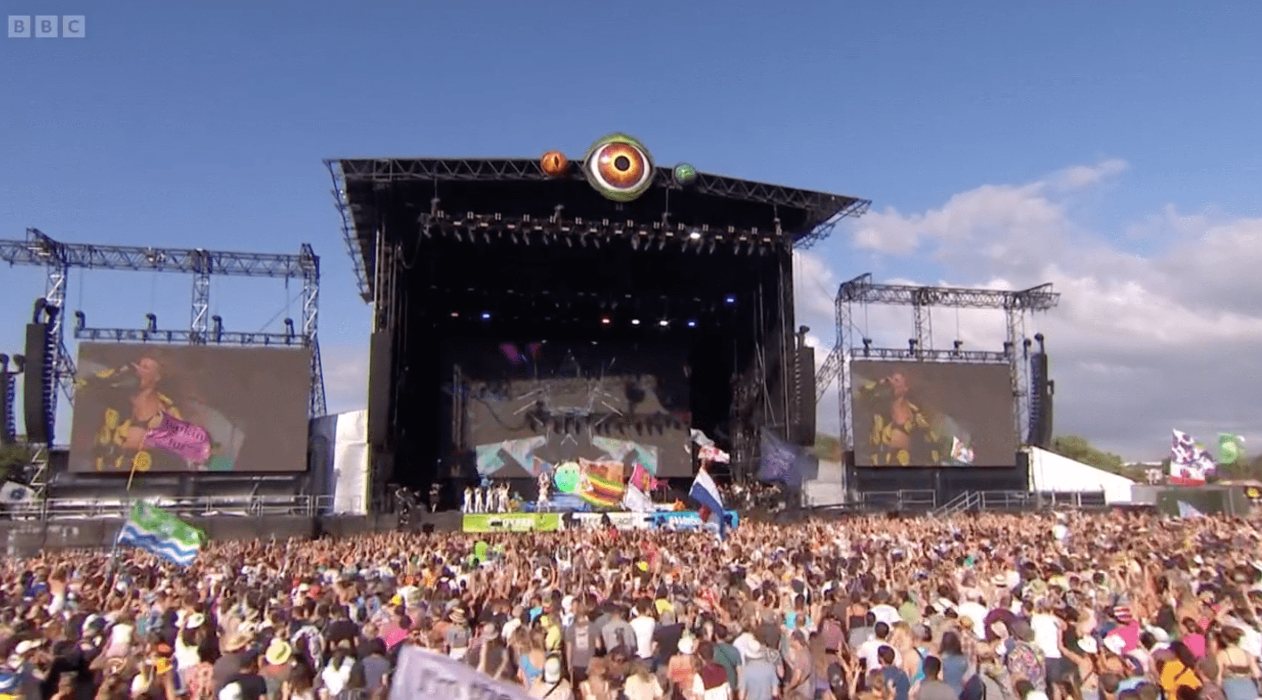 Glastonbury Festival's Pyramid stage with crowd waving flags