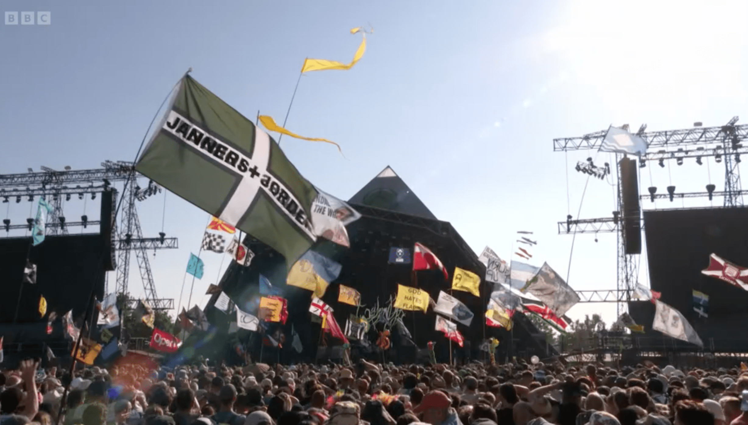 Glastonbury Festival's Pyramid stage with crowd waving flags