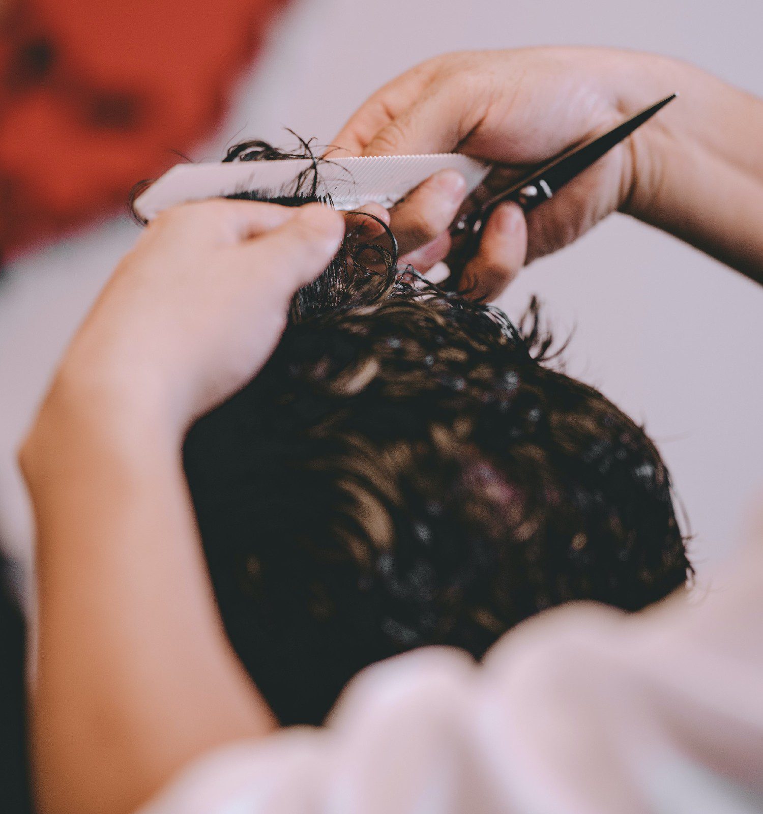 Man's hair being cut