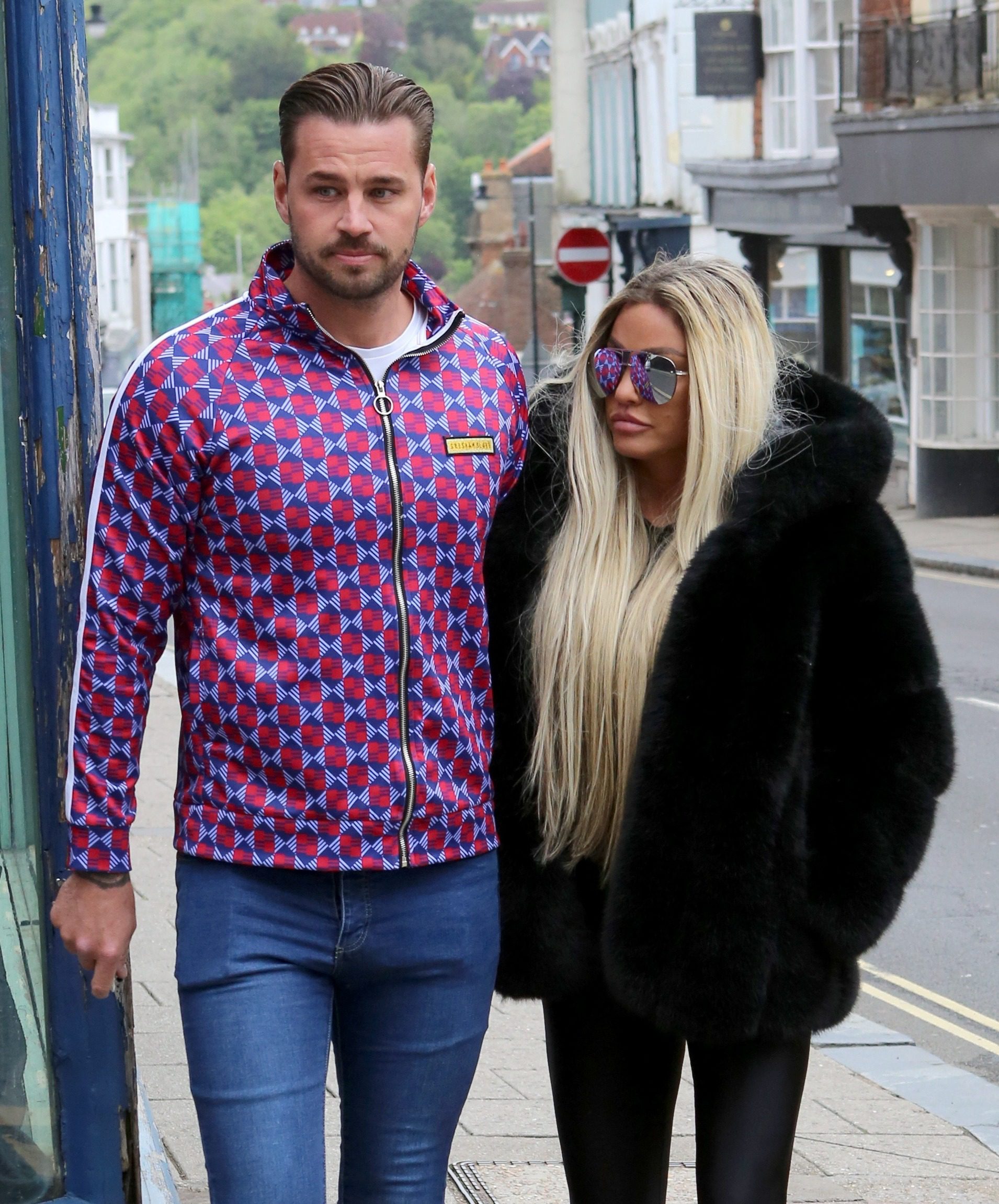 Katie Price and Carl Woods walking together 
