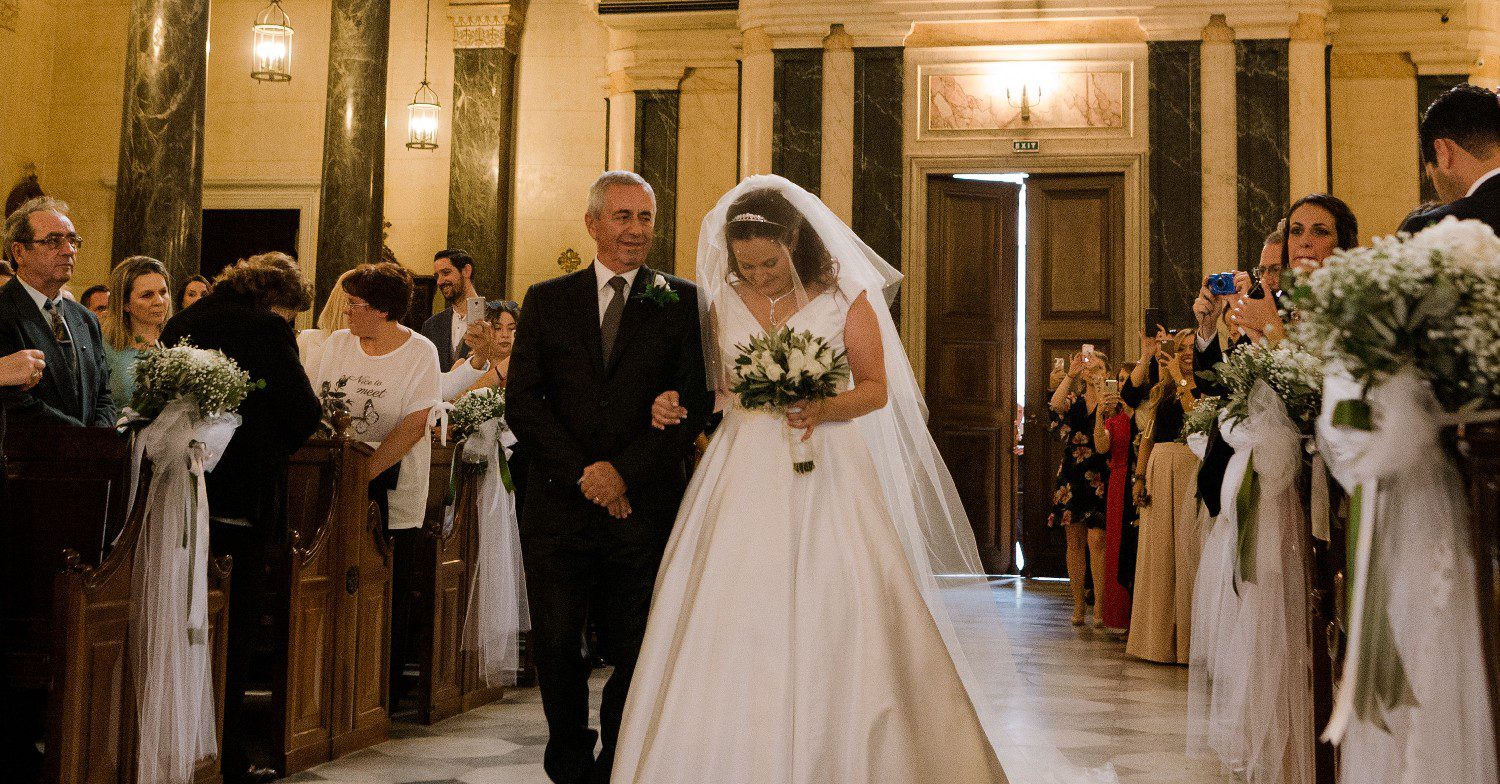 Dad walking daughter down the aisle