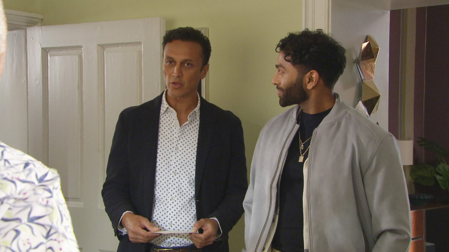 Emmerdale's Jai and Suni are standing next to each other